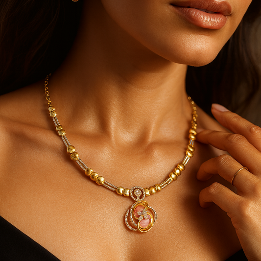 Close-up of a woman wearing a gold necklace with a pendant.